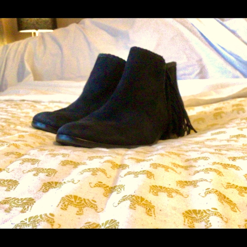 Black suede Sam Edalman ankle boot with fringe detailing.